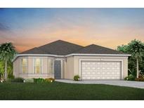 Charming single-story home featuring a neutral color scheme, lush landscaping, and a two-car garage at 1530 Groveline Rd, St Cloud, FL 34771