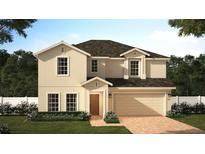 Two-story home with attached two-car garage, covered entry, manicured lawn and mulled windows at 4009 Serene Water Ave, Eustis, FL 32736