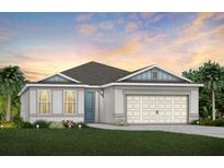 Charming single-story home featuring a two-car garage and well-manicured lawn, perfect for suburban living at 6015 Tree Crossing Ln, St Cloud, FL 34771