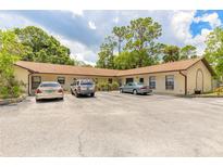A well-maintained exterior with parking spaces and a serene green surrounding at 1710 Espanola Ave, Daytona Beach, FL 32117