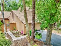 Inviting home exterior with well-kept landscaping and a charming walkway leading to the entrance at 104 Autumn Dr, Longwood, FL 32779