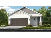 Charming single-Gathering home featuring a neutral palette, two-car garage and manicured lawn at 1023 Ladyfish Trl, St Cloud, FL 34771