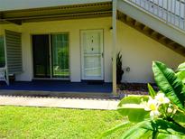 Condo exterior featuring a sliding glass door and front door beneath the stairway at 1935 Conway Rd # M1, Orlando, FL 32812