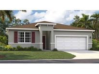 Beautiful single-story home with a two-car garage, well-maintained lawn, and a modern architectural design at 1122 Clay Blvd, Tavares, FL 32778