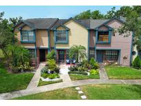 Charming townhomes with colorful exteriors, landscaped front yards, and inviting curb appeal at 2817 Revere Ct, Casselberry, FL 32707