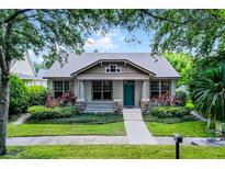 Charming single-story home with landscaped front yard and inviting blue door at 12524 Aldershot Ln, Windermere, FL 34786