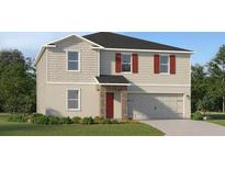 Charming two-story home with gray siding, red shutters, stone accents, and a well-manicured lawn at 3684 Rolling Ridge Bnd, Davenport, FL 33837