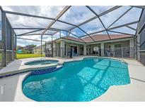 Screened-in pool and hot tub area, perfect for outdoor relaxation and entertaining at 344 Barbera Dr, Davenport, FL 33897