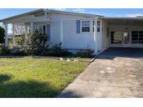 Single story home with carport and covered porch at 24822 Pine Hl, Leesburg, FL 34748