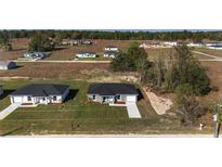 New construction home showing the front yard, driveway, and attached garage in a growing neighborhood at 3654 Sw 149 Ter, Ocala, FL 34481