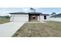 Beautiful single-story home featuring an attached garage and modern architectural details at 3547 Sw 130Th Lane Rd, Ocala, FL 34473