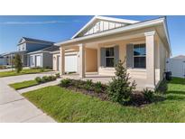 Charming single-story home featuring a covered porch, well-manicured lawn, and attached two-car garage at 6200 Sw 72Nd Ter, Ocala, FL 34474