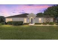 Charming single-story home with well-manicured lawn at 7066 Sw 91St Ct, Ocala, FL 34481