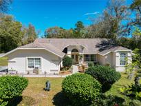 Charming single-story home with manicured lawn and mature landscaping, perfect for curb appeal at 9805 Sw 190Th Terrace Rd, Dunnellon, FL 34432