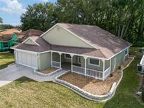 Attractive single-story house with a two-car garage and landscaped yard at 10975 Sw 69Th Cir, Ocala, FL 34476