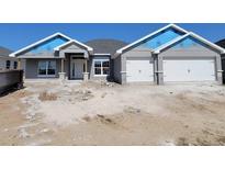 Charming single-story home with a two-car garage and neutral gray paint at 8309 Sw 58Th Ave, Ocala, FL 34476