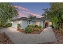 Charming single-story home with landscaped yard and paver driveway at 8718 Sw 83Rd Loop, Ocala, FL 34481