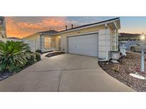 Attractive single-story home with a two-car garage and landscaped front yard at 2840 Leicester Ter, The Villages, FL 32162