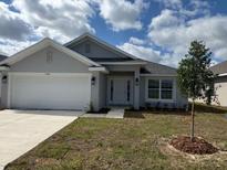 Charming single-story home with a well-manicured front yard and a two-car garage at 2138 Nw 23Rd Loop, Ocala, FL 34475