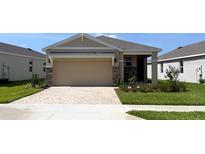 Charming single-story home with a brick-paved driveway and well-maintained landscaping at 4072 Nw 44Th Cir, Ocala, FL 34482