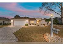 Inviting home with a landscaped yard, and a two-car garage at 9910 Se 138Th Loop, Summerfield, FL 34491