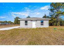 Newly constructed single story home with front yard and driveway at 13183 Sw 113Th Place, Dunnellon, FL 34432