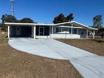 Single story home with carport and screened porch at 8973 Sw 101St Ln, Ocala, FL 34481