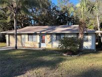 Cute ranch home with attached garage and nicely landscaped yard at 2317 Ne 37Th St, Ocala, FL 34479