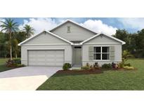 One-story home with gray siding, a two-car garage, and landscaping at 342 Hickory Course Trl, Ocala, FL 34472