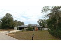 Single-story home with attached garage and spacious yard at 5491 Sw 100Th Loop, Ocala, FL 34476