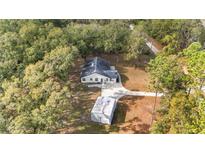 Aerial view of a house with a detached workshop at 13740 Sw 49Th Pl, Ocala, FL 34481