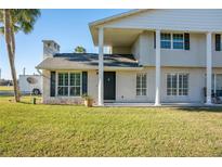 Brick house with a covered entryway, and a manicured lawn at 4343 Nw 80Th Ave # 4, Ocala, FL 34482