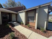 Inviting home with a well-maintained yard and pathway leading to the front door at 4542 Ne 4Th St, Ocala, FL 34470