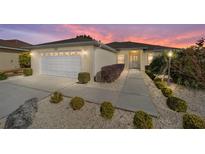 Well-maintained house with a landscaped yard and driveway at 8086 Sw 81St Loop, Ocala, FL 34476