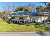 Single-story home with a carport and well-maintained lawn at 8653 Sw 96Th St # A, Ocala, FL 34481