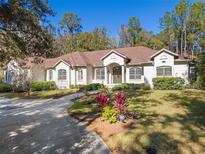 Beautiful one-story home with a large front yard, landscaping, and driveway at 995 Sw 37Th Place Rd, Ocala, FL 34471