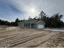 Newly constructed home with a one car garage at 24300 Sw Sea Cliff Ave, Dunnellon, FL 34431