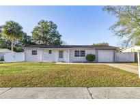 Charming ranch house with a fenced yard and driveway at 14470 Sw 34Th Terrace Rd, Ocala, FL 34473