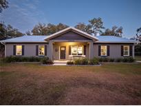 Charming ranch home with metal roof and landscaped yard at 14515 Ne 110Th Avenue Rd, Fort Mc Coy, FL 32134