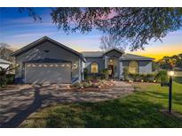 Attractive one-story home with a two-car garage and well-manicured landscaping at 9554 Sw 93Rd Loop, Ocala, FL 34481