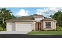 Tan three-car garage home with red front door and landscaping at 19448 Sw 78Th Pl, Dunnellon, FL 34432