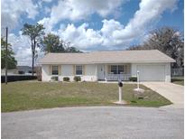 Charming single-story home with a well-maintained lawn, garage, and delightful curb appeal at 4172 Ne 35Th Avenue Rd, Ocala, FL 34479