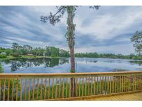 Lakefront home with deck offering serene views at 13055 Ne 7Th Loop, Silver Springs, FL 34488