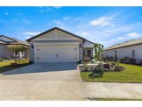 Single-story home with attached garage and landscaped front yard at 8332 Sw 54Th Loop, Ocala, FL 34481