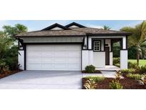 One-story home with white siding, dark trim, and a two-car garage at 4068 Nw 44Th Cir, Ocala, FL 34482