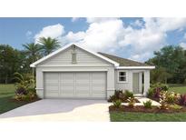 One-story home with light gray siding, two-car garage, and landscaping at 8666 Sw 44Th Ter, Ocala, FL 34476