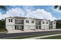 New townhome development showcasing multiple units with attached garages at 6588 Sw 81St Loop, Ocala, FL 34476