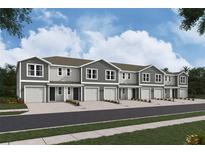 New townhome community with attached garages and landscaping at 6602 Sw 81St Loop, Ocala, FL 34476