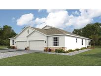 Two-car garage, light colored exterior, landscaping at 4748 Nw 39Th Street Rd, Ocala, FL 34482