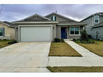 Curb appeal abounds in this charming one-story home featuring a two-car garage and well-manicured lawn at 7208 Sw 61St Sw Pl, Ocala, FL 34474